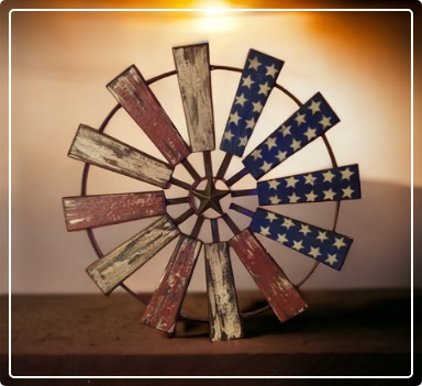 A wooden wheel with stars and stripes painted on it.